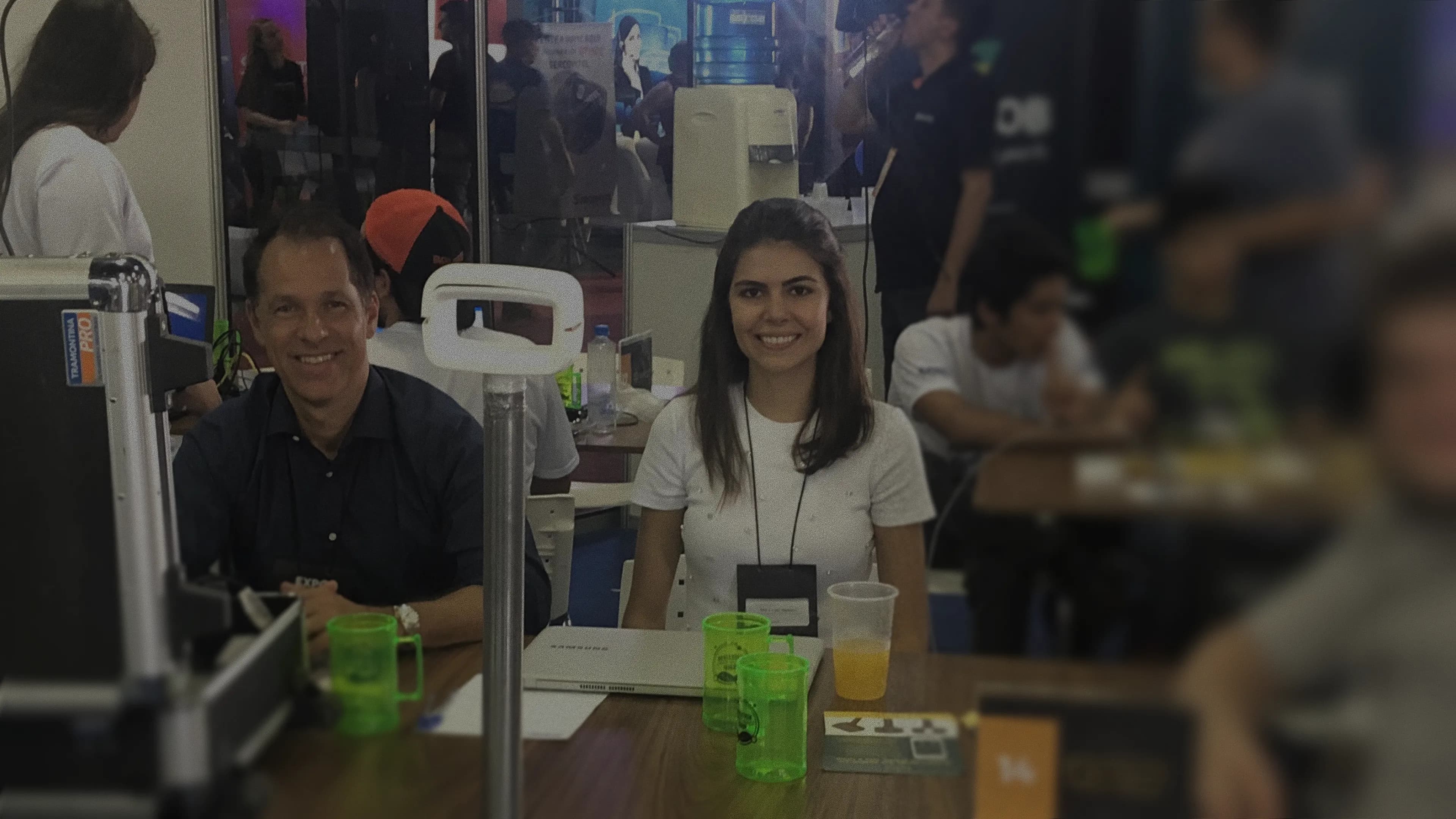 2 persons working on a expo