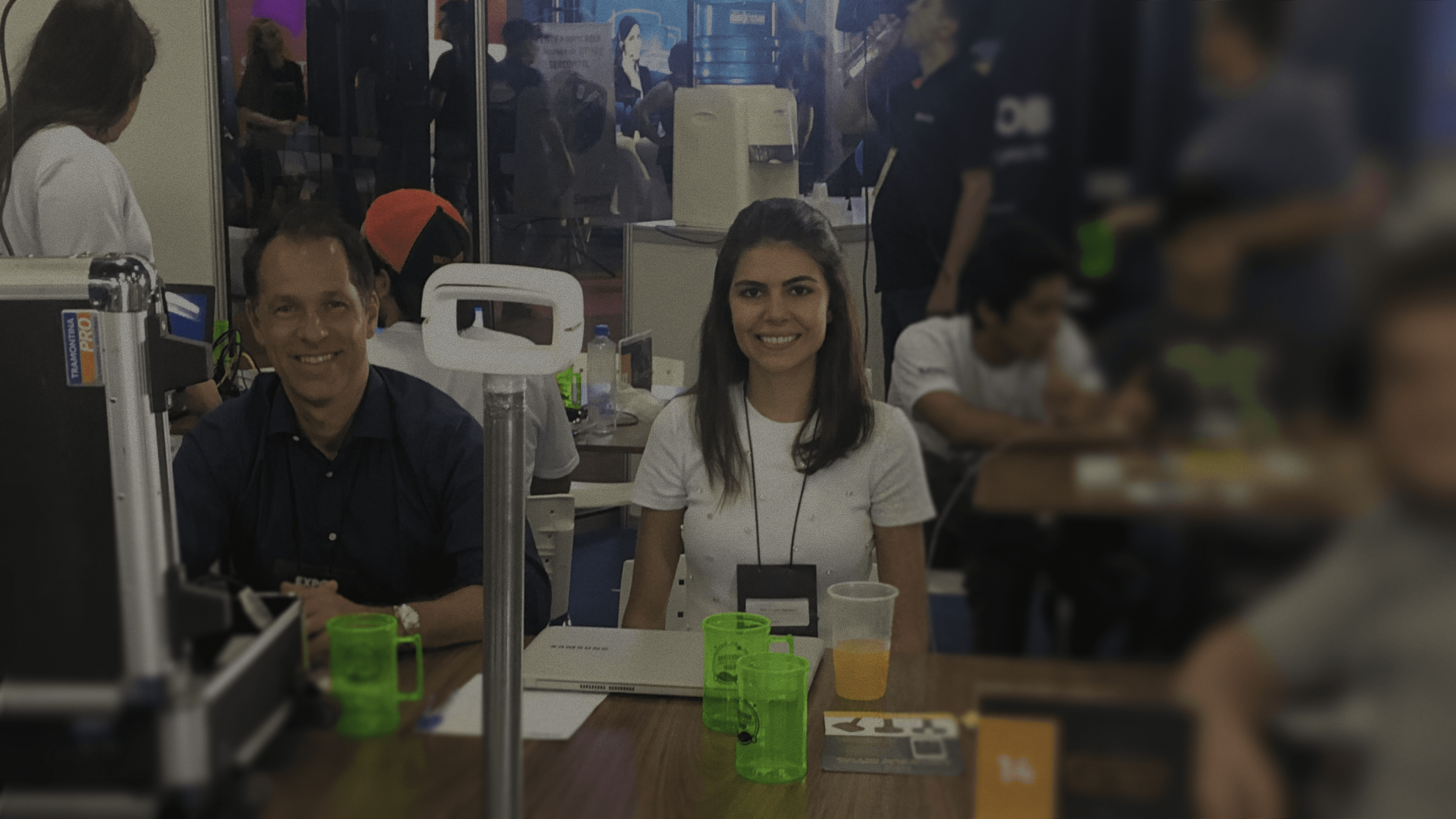 2 persons working on a expo